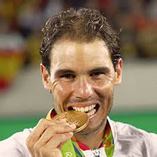 Rafael Nadal playing tennis at a tournament